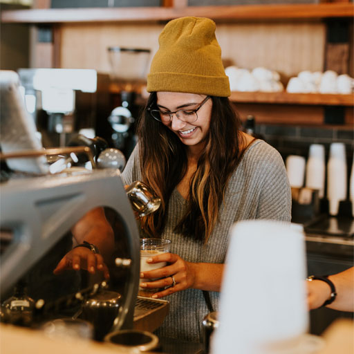 Pacific Donuts staff member preparing beverage